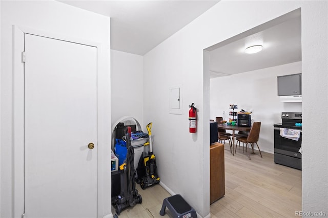 1112 W Mesa Ave Unit 1114, Pueblo, CO 81004 - hall with light wood-style floors, electric panel, and baseboards