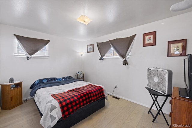 1112 W Mesa Ave Unit 1114, Pueblo, CO 81004 - bedroom featuring light wood-type flooring and baseboards
