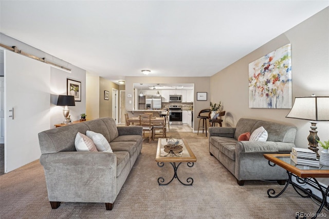 living room with light colored carpet