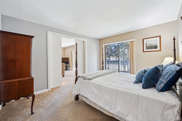 bedroom featuring light colored carpet and access to outside