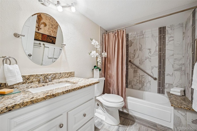 full bathroom featuring vanity, a textured ceiling, shower / tub combo with curtain, and toilet