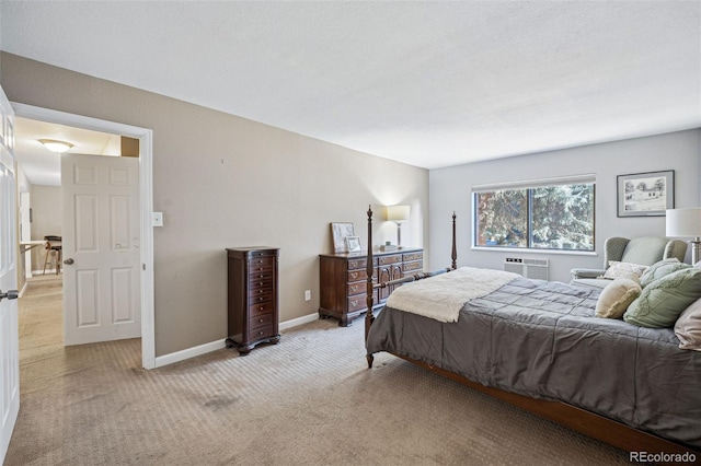 carpeted bedroom featuring an AC wall unit