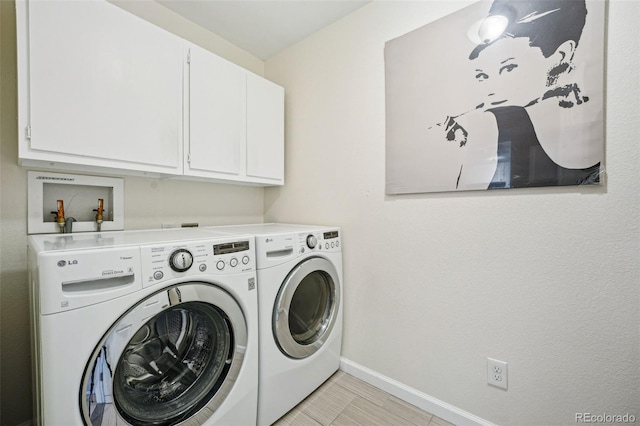 laundry room featuring cabinets, independent washer and dryer, and light tile patterned floors