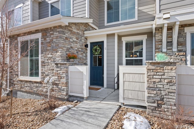 entrance to property with stone siding