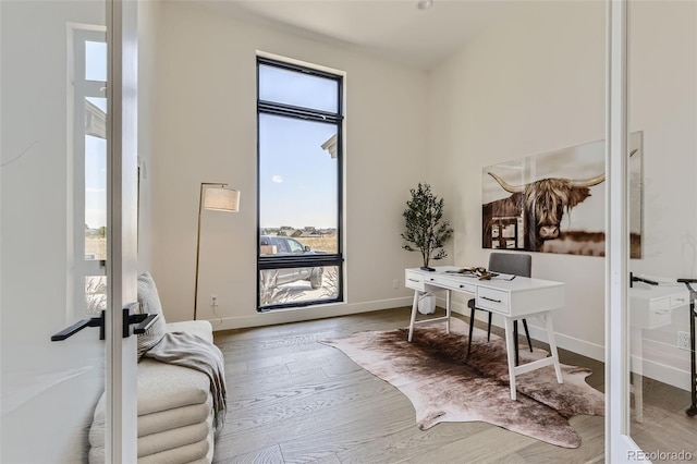 office area with hardwood / wood-style floors