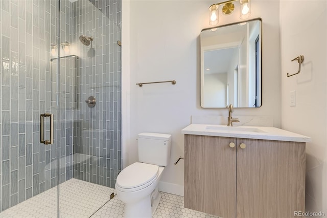 bathroom featuring walk in shower, vanity, toilet, and tile patterned flooring