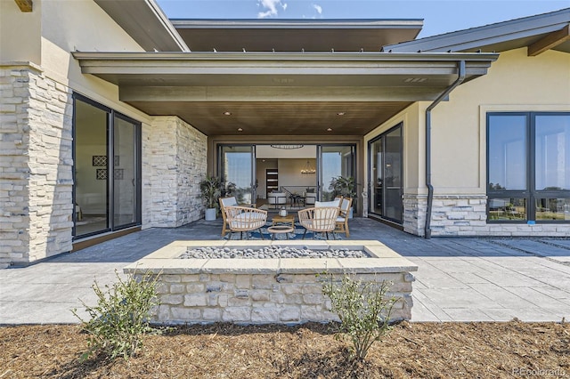 view of patio featuring a fire pit