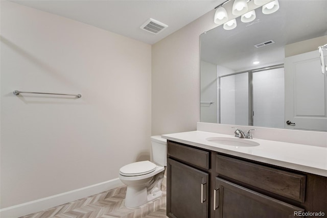 bathroom featuring toilet, a stall shower, visible vents, and baseboards