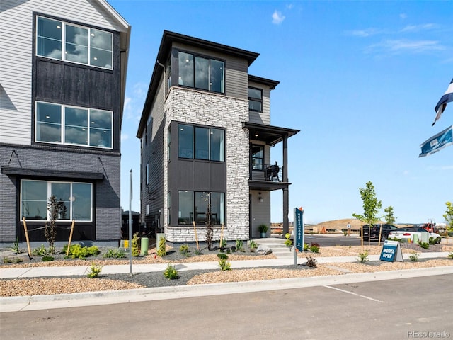 1787 W 166th Ave, Broomfield, CO 80023 - modern home featuring stone siding and a balcony