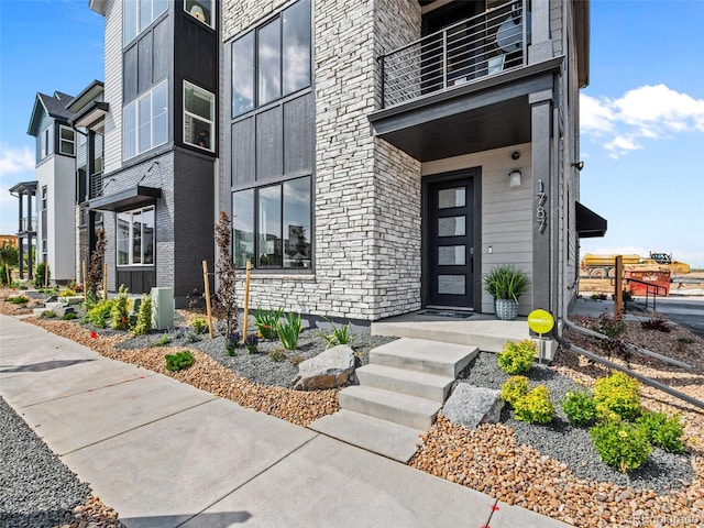 1787 W 166th Ave, Broomfield, CO 80023 - entrance to property featuring a balcony and stone siding
