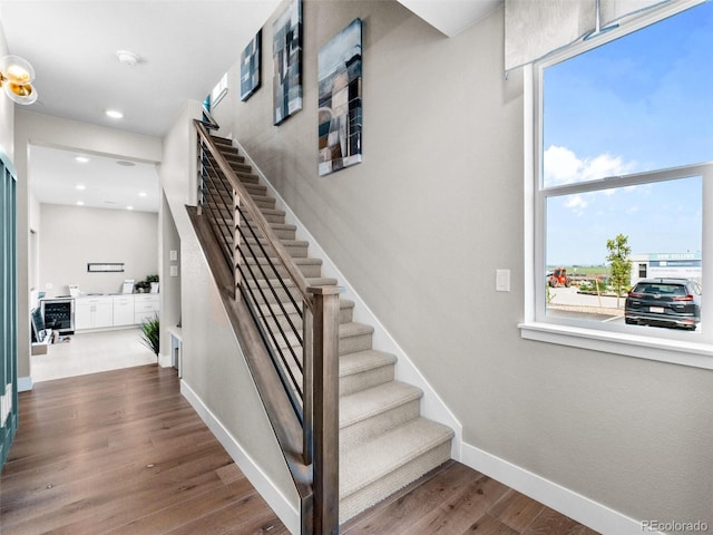 1787 W 166th Ave, Broomfield, CO 80023 - stairway featuring wood finished floors, recessed lighting, and beverage cooler