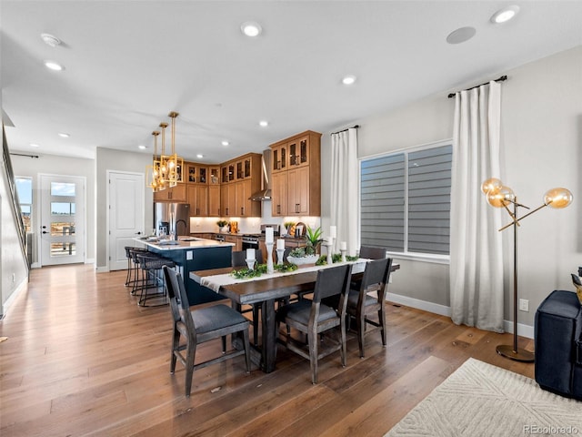 1787 W 166th Ave, Broomfield, CO 80023 - dining room featuring a chandelier, light wood-type flooring, and recessed lighting