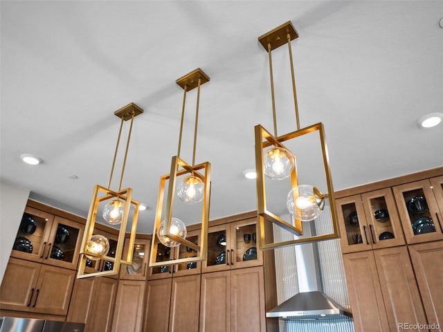 1787 W 166th Ave, Broomfield, CO 80023 - kitchen view of brown cabinetry, hanging light fixtures, and glass insert cabinets