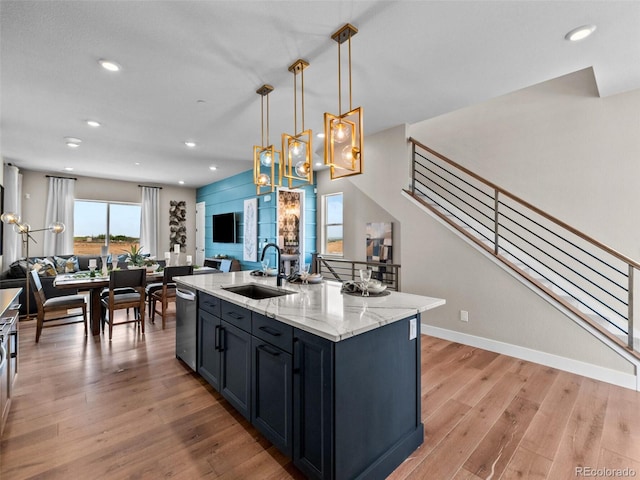1787 W 166th Ave, Broomfield, CO 80023 - kitchen featuring open floor plan, light wood-style flooring, stainless steel dishwasher, and recessed lighting