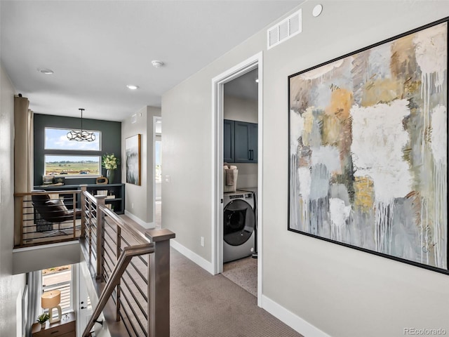 1787 W 166th Ave, Broomfield, CO 80023 - hall with washer / dryer, an upstairs landing, carpet, a chandelier, and recessed lighting