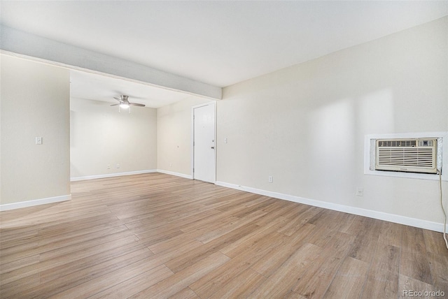 16259 W 10th Ave Unit K-3, Golden, CO 80401 - unfurnished room featuring light wood-type flooring, a ceiling fan, and a wall mounted air conditioner