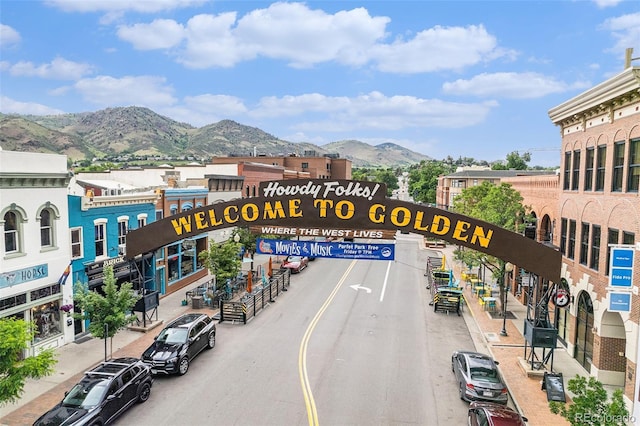 16259 W 10th Ave Unit K-3, Golden, CO 80401 - view of asphalt road featuring a mountain view, sidewalks, street lights, and curbs