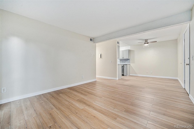16259 W 10th Ave Unit K-3, Golden, CO 80401 - unfurnished living room with light wood finished floors and a ceiling fan
