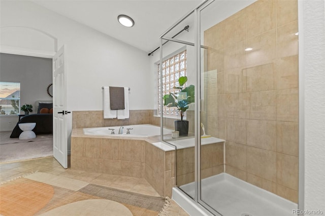 bathroom featuring tile patterned floors and plus walk in shower