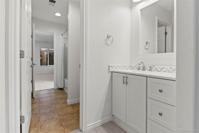 bathroom with shower / tub combo with curtain and vanity