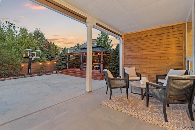 patio terrace at dusk with a gazebo and outdoor lounge area