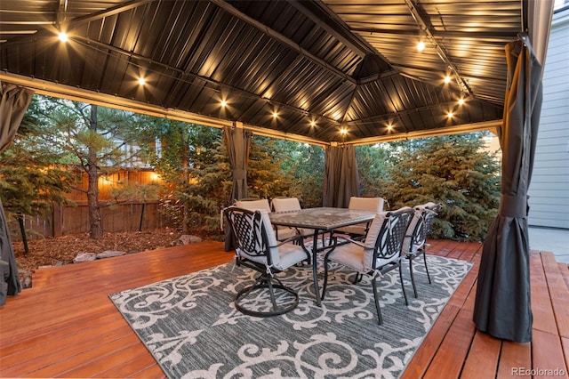 wooden terrace featuring a gazebo