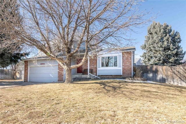 view of front of house with a garage and a front lawn