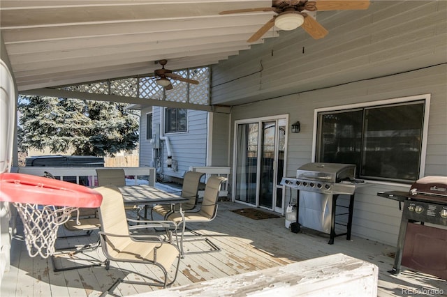 wooden deck featuring a grill and ceiling fan