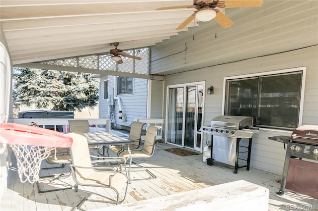 wooden deck with a grill and ceiling fan