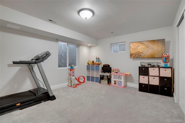 interior space featuring carpet flooring, visible vents, and baseboards