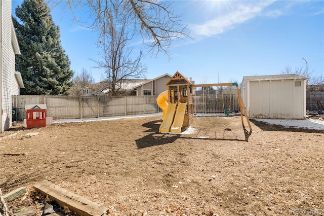 view of play area with a storage unit, an outdoor structure, and a fenced backyard