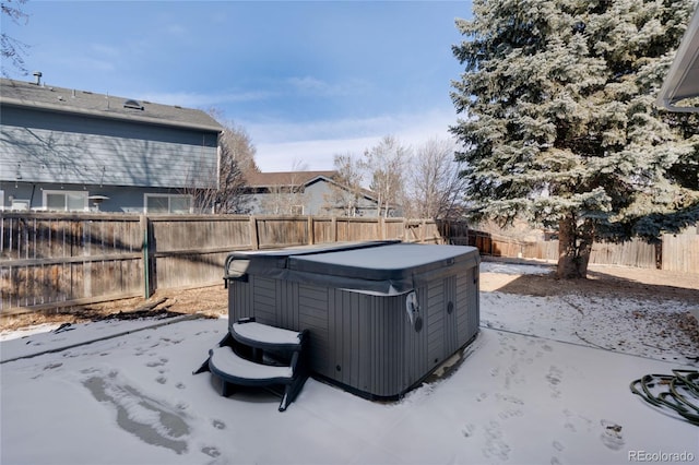 view of yard featuring a fenced backyard and a hot tub