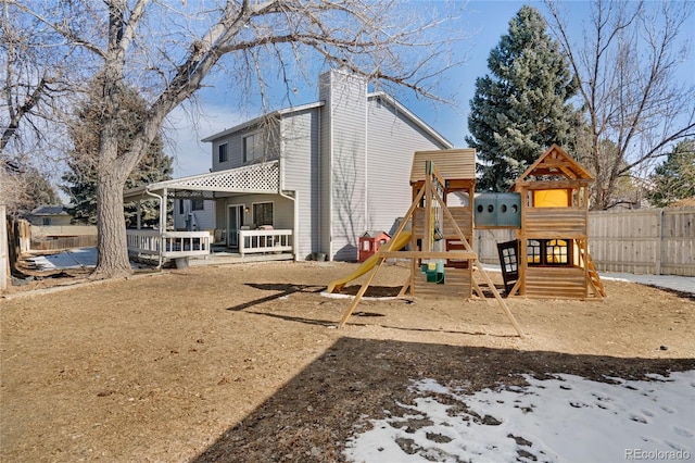 view of jungle gym featuring fence