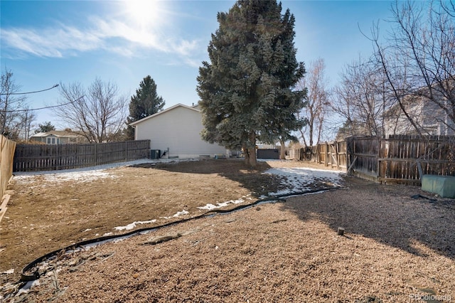 view of yard with a fenced backyard