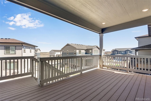 wooden deck featuring a residential view