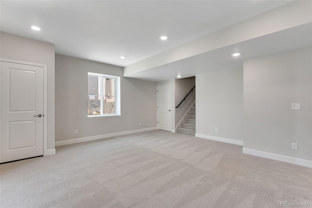 basement with stairway, light colored carpet, and recessed lighting