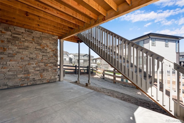 view of patio / terrace with a residential view and stairs