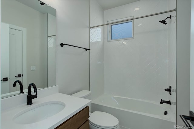 full bathroom with tiled shower / bath combo, toilet, and vanity