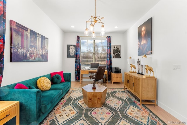 office area featuring an inviting chandelier, baseboards, wood finished floors, and recessed lighting