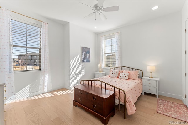 bedroom with a ceiling fan, recessed lighting, baseboards, and wood finished floors