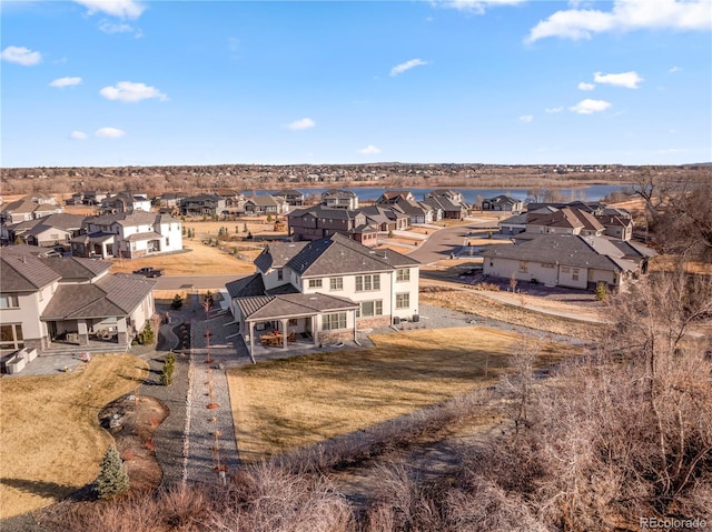 birds eye view of property featuring a residential view and a water view