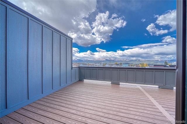 wooden deck featuring a mountain view