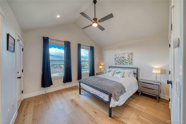 bedroom with vaulted ceiling, ceiling fan, and hardwood / wood-style floors