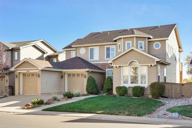 view of front of house with a garage and a front yard