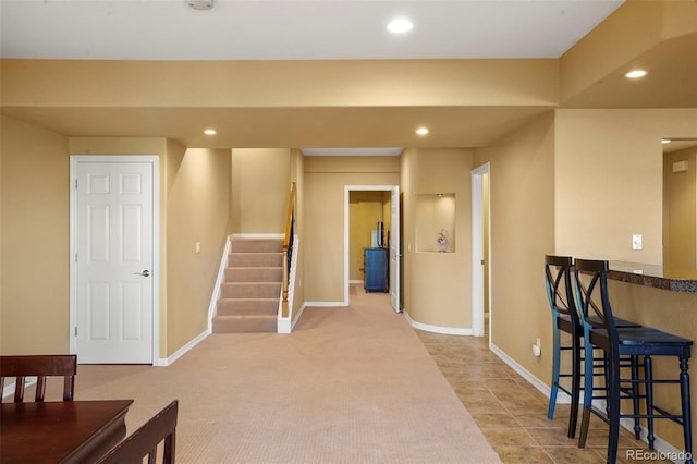 interior space featuring light colored carpet