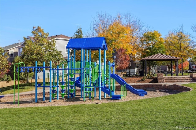 view of playground with a gazebo and a lawn