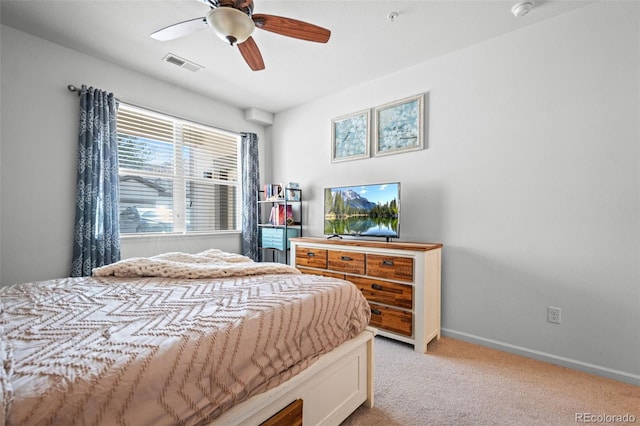 bedroom featuring baseboards, visible vents, ceiling fan, and light colored carpet