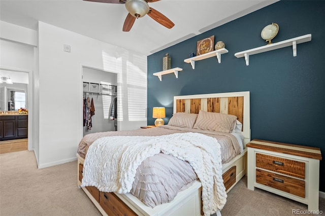 carpeted bedroom with a closet, a ceiling fan, and baseboards