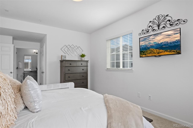 carpeted bedroom featuring baseboards