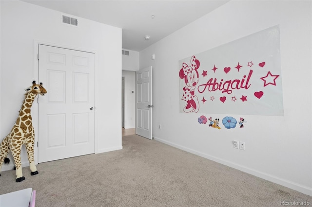 recreation room with baseboards, visible vents, and carpet floors